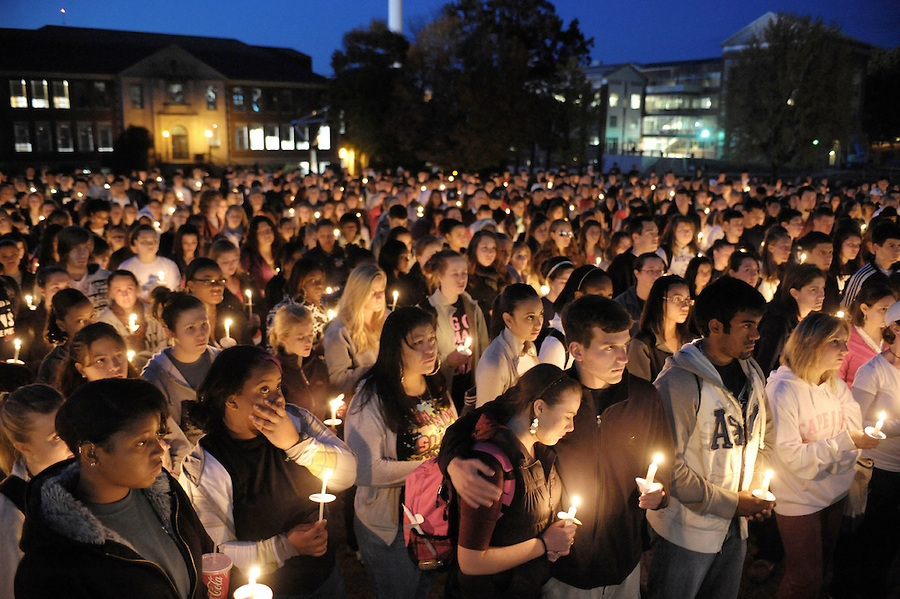 Students gather for a candle vigil for Connecticut football player Jasper Howard in Storrs, Conn., Wednesday, Oct. 21, 2009. Twenty-year-old Howard, of Miami, a junior and starting cornerback, and a second person were stabbed during a fight early Sunday after someone pulled a fire alarm during a dance at the UConn Student Union, police said.